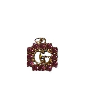 Gucci pendant charm, repurposed from a zipper pull.